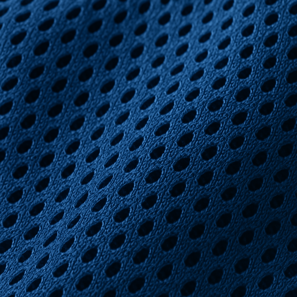 A close-up shot of breathable athletic fabric showing the textured mesh pattern